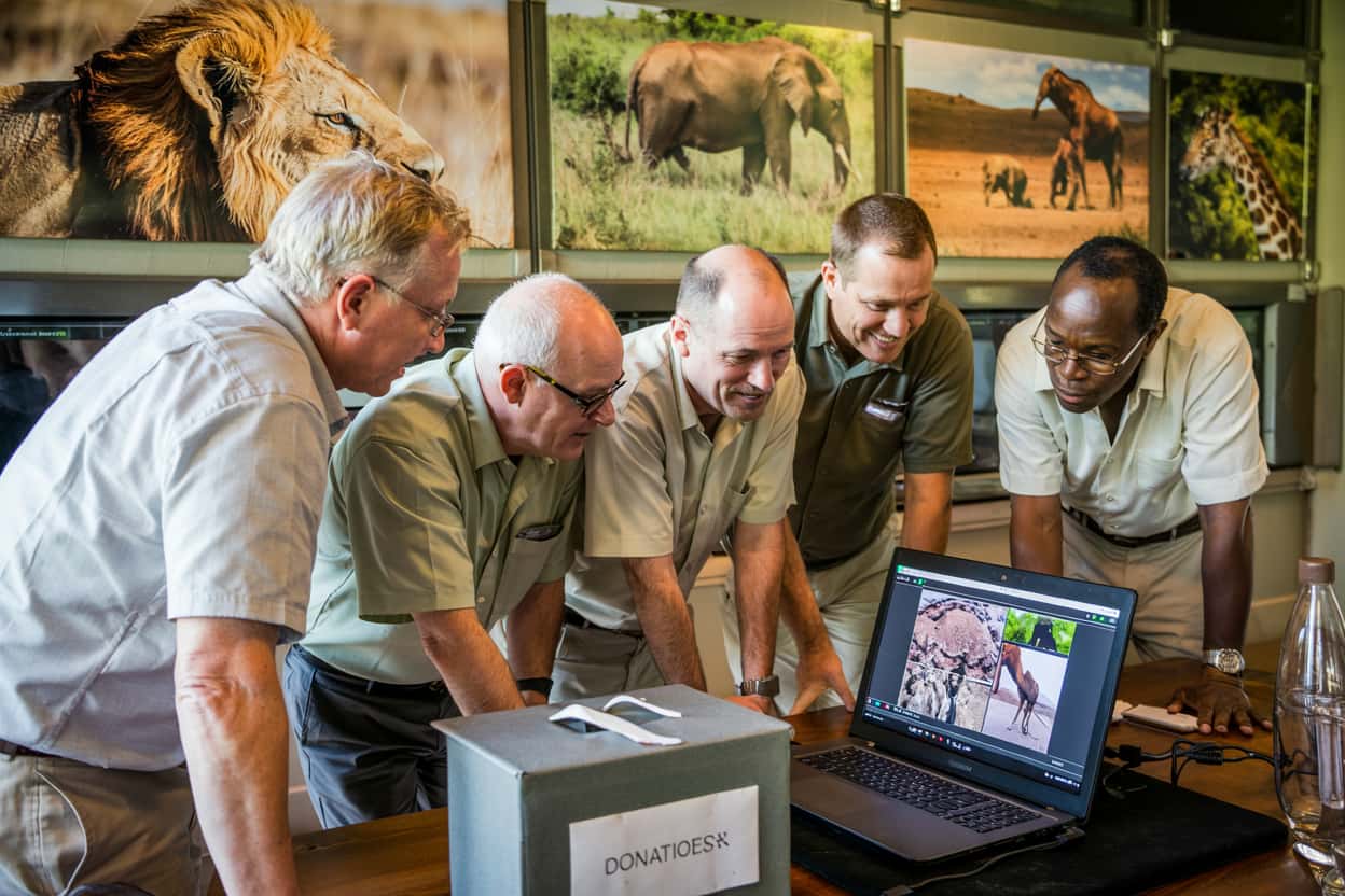 Traveler engaging with conservation work beyond a safari
