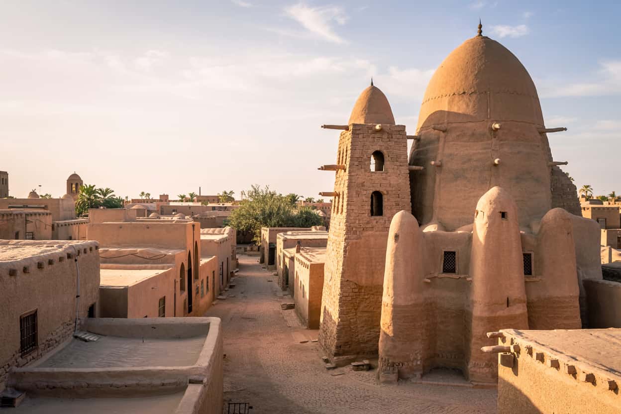 Ancient mud-brick mosques of Timbuktu with desert sand streets